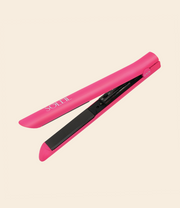 pink soleil flat iron with black ceramic plate and details, with on and off button