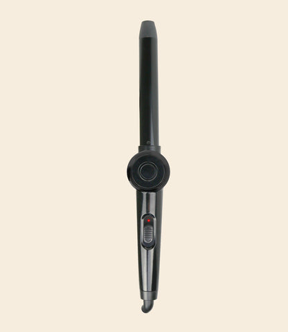soleil black angle wand curling iron with one power button against a beige background