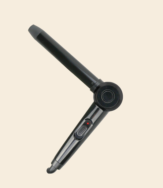soleil black angle wand curling iron bended in V form, with one power button against a beige background