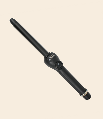 soleil black curling iron with one power button, barrel with 19mm and silver details against a light beige background