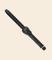 soleil black curling iron with one power button, barrel with 25mm and silver details against a light beige background